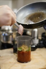 Cooking Process The Exciting Activity of Adding Ingredients to a Glass