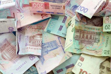 Big amount of different Ukrainian hryvnia money bills. Pile of crumpled ukrainian banknotes