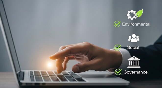 Person using laptop with E S G icons hand keyboard