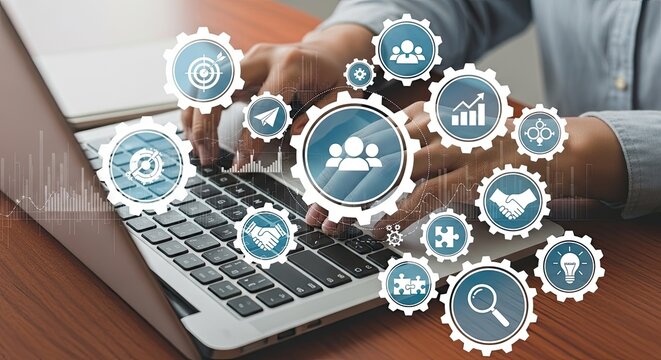 Hands typing on a laptop keyboard with glowing digital gears and business technology icons symbolizing workflow and strategy