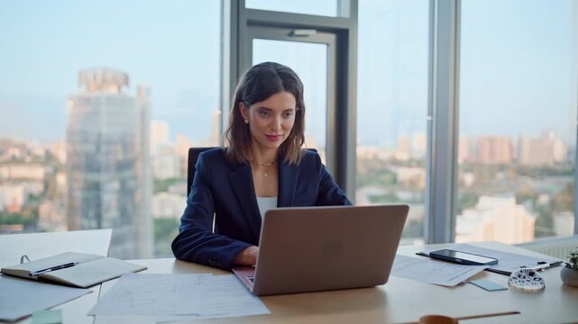 Successful lady looking laptop sitting office desk closeup. Smiling woman - Powered by Adobe