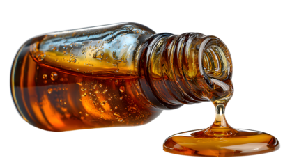 Clear essential oil dripping from dropper isolated on white background