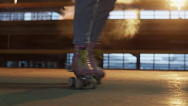 Woman wearing quad roller skates dances on parking site floor