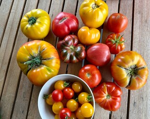 Different Kind of tomatoes on a wooden table