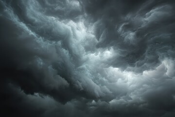 Dark, swirling storm clouds fill the sky, creating a dramatic and intense atmosphere with shades of gray and white
