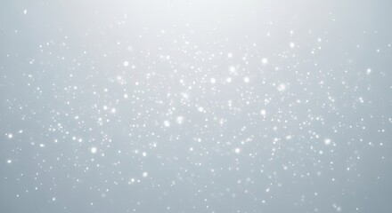 Softly falling delicate white sparkles and bokeh lights creating a gentle and ethereal winter wonderland background