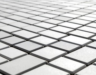 Close-up view of a repeating grid pattern of light gray paving stones