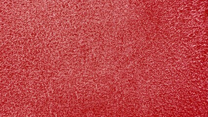 vibrant red velvet textured surface with rich soft sheen ideal for festive background or luxury...
