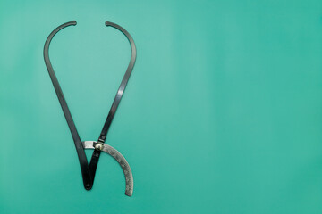Black Obstetric Tazometer on green Background, Space for Text, Space for Logo