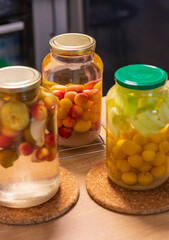 Canned compote in jars of various fruits and berries. Food