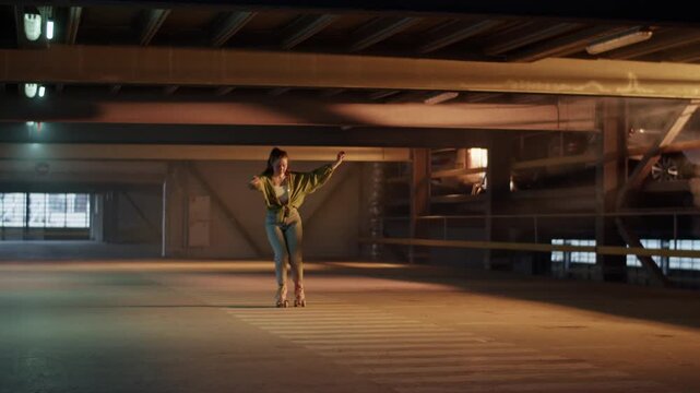 Stylish young woman roller skater dancing in empty parking garage