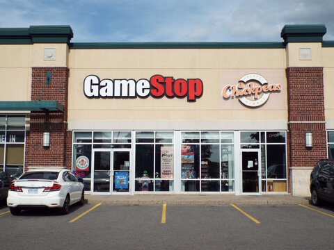 Ottawa, ON, Canada, June 12, 2025: The storefronts of two businesses: "GameStop" video game store, and a restaurant or eatery named "Chickpeas" at  500 Terminal Ave. 