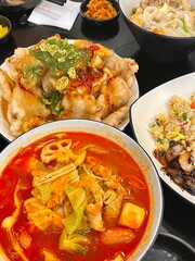 Spicy and numbing malatang with a mix of fresh ingredients in rich Sichuan broth, paired with crispy and tangy guobaorou. A perfect balance of bold heat and sweet-sour crunch for a Chinese feast.