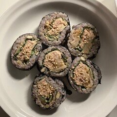 Delicious kimbap rolls filled with fresh vegetables, seasoned rice, and savory proteins, all wrapped in crisp seaweed. A perfect combination of flavor and texture in every bite.