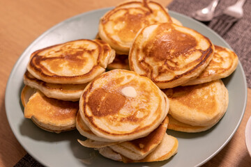 Freshly baked pancakes on the ceramic plate. Food