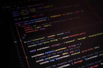Close-up of JavaScript code editor showing real-time event handling and server communication setup for modern web application development.