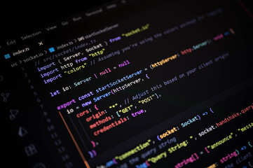 Close-up of colorful TypeScript code on a dark screen, showcasing modern backend development, socket programming, and real-time server technology in web applications.