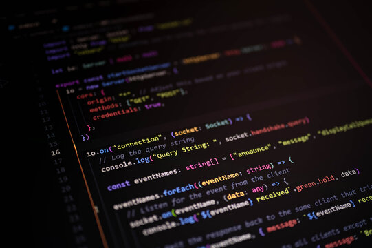 Close-up of JavaScript code editor showing real-time event handling and server communication setup for modern web application development.