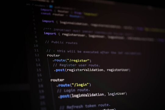 Close-up of JavaScript backend code showing user authentication routing for register and login endpoints using Express framework in a modern web application.