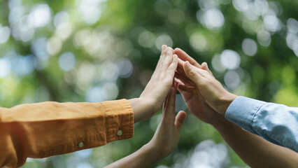 Environmental concept, business people join forces on World Environment Day and global community teamwork the global environment, society and environment CSR and sustainable development.