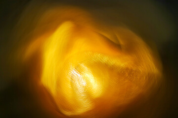 Abstract glowing orange light in motion forming soft curves and dynamic energy flow for digital art background
