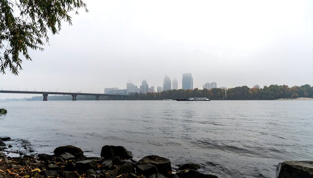 Misty river view with city skyline