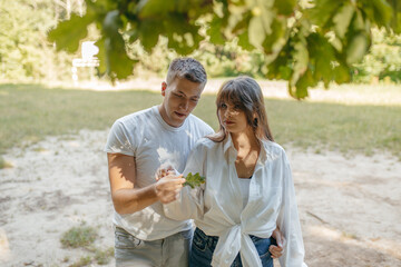 Obraz premium Young couple relax at nature at summer 