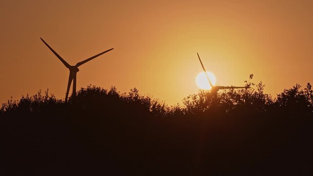 Danish sunrise between windmills in slow motion 4k: 2025