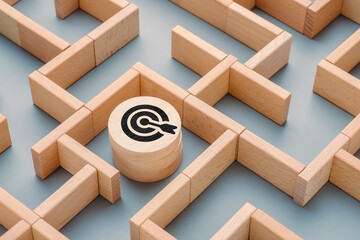 Wooden maze with a target icon block at the center, concept of finding goals through complexity, navigating challenges in business, marketing, and personal decision-making