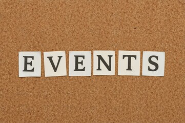 Cut-out magazine letters spelling 'Events' pinned on a corkboard, representing news, special occasions, or factors impacting business strategies