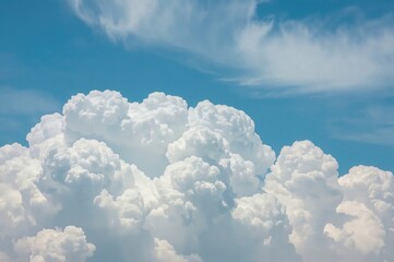 Amazing fluffy white clouds set against a bright blue sky