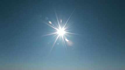 Bright sunburst in clear blue sky with ample space for text, capturing a brilliant daylight scene with crisp colors and calm atmosphere