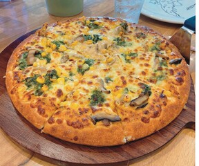 This vegetarian pizza bursts with colors and flavors, each bite a taste of nature.