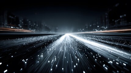 Abstract, futuristic photograph representing high-speed data transfer. Glowing blue lines of light and particles stream forward on a dark digital highway.