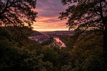 Twilight view of a riverside park with trees and natural scenery