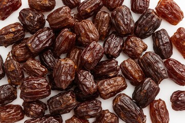 Pile of delicious dried dates against a white backdrop