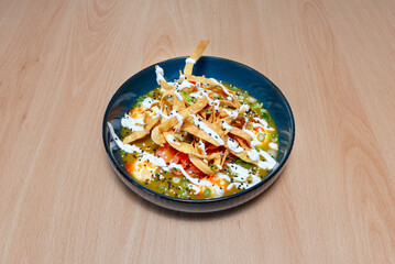 Tricolor tiradito: alternating layers of white fish, salmon, and tuna, with three sauces (rocoto, yellow chili, and black olives) in an artistic presentation