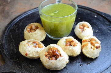 Crispy, hollow puris filled with spicy tangy water, mashed potato, chickpeas, and chutneys—pani puri is India’s most loved street food, bursting with flavor in every bite.