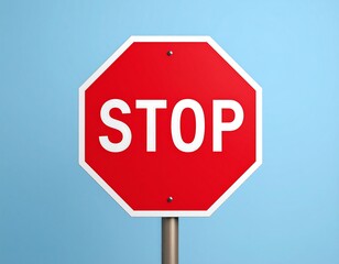 Octagonal Red Stop Sign Against Light Blue Background.