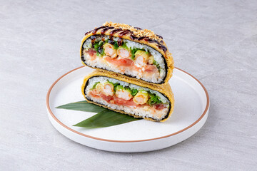 Crispy Japanese onigirazu sandwich with shrimp tempura, vegetables, and rice