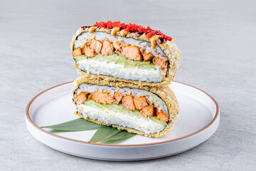 Crispy Japanese onigirazu sandwich with salmon, cucumber, cream cheese, and rice