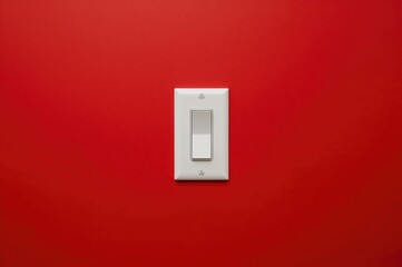 A modern, simple light switch installed on a vibrant red surface.
