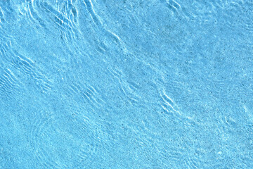 Blue sea ocean water surface ripples underwater sand