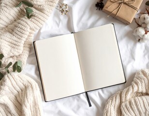 Blank Open Notebook On White Sheets With Cozy Knitted Sweater And Gifts