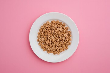 Top View Of A Bowl Of Dry Cereal On A Vibrant Surface