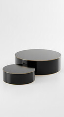 Two black cylindrical platforms with gold trim, on white background, ideal product display or mockup for advertising, showcasing elegance and minimalism