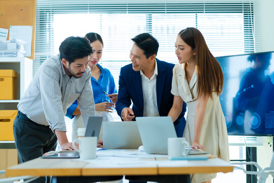 Group of creative Businesspeople brain storm meeting presentation,discussing roadmap to product launch, planning,strategy,dashboard,new business development,working with new startup project in office 