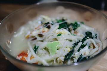 Delicious Bowl of Noodle Soup with Fresh Vegetables and Savory Broth for a Comforting Meal Experience