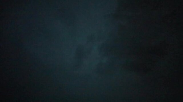 Lightning in the sky during rain in nature