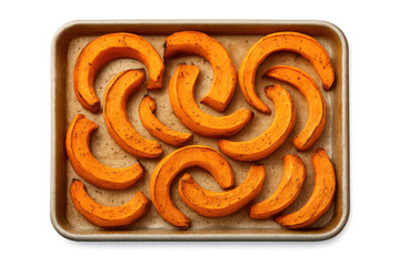 Roasted pumpkin slices arranged on baking sheet with transparent background